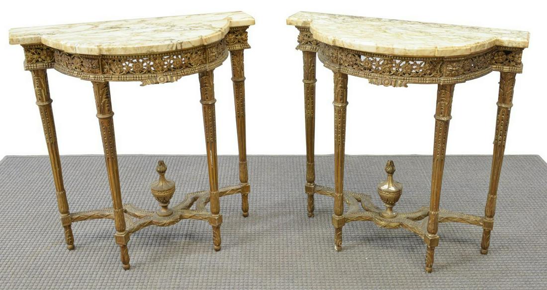 (2) LOUIS XVI STYLE MARBLE-TOP CONSOLE TABLES: (lot of 2) French Louis XVI style console tables, late 19th c., shaped marble top, over giltwood frame, openwork floral apron with beaded trim, rising on tapered fluted legs with acanthus details, joi