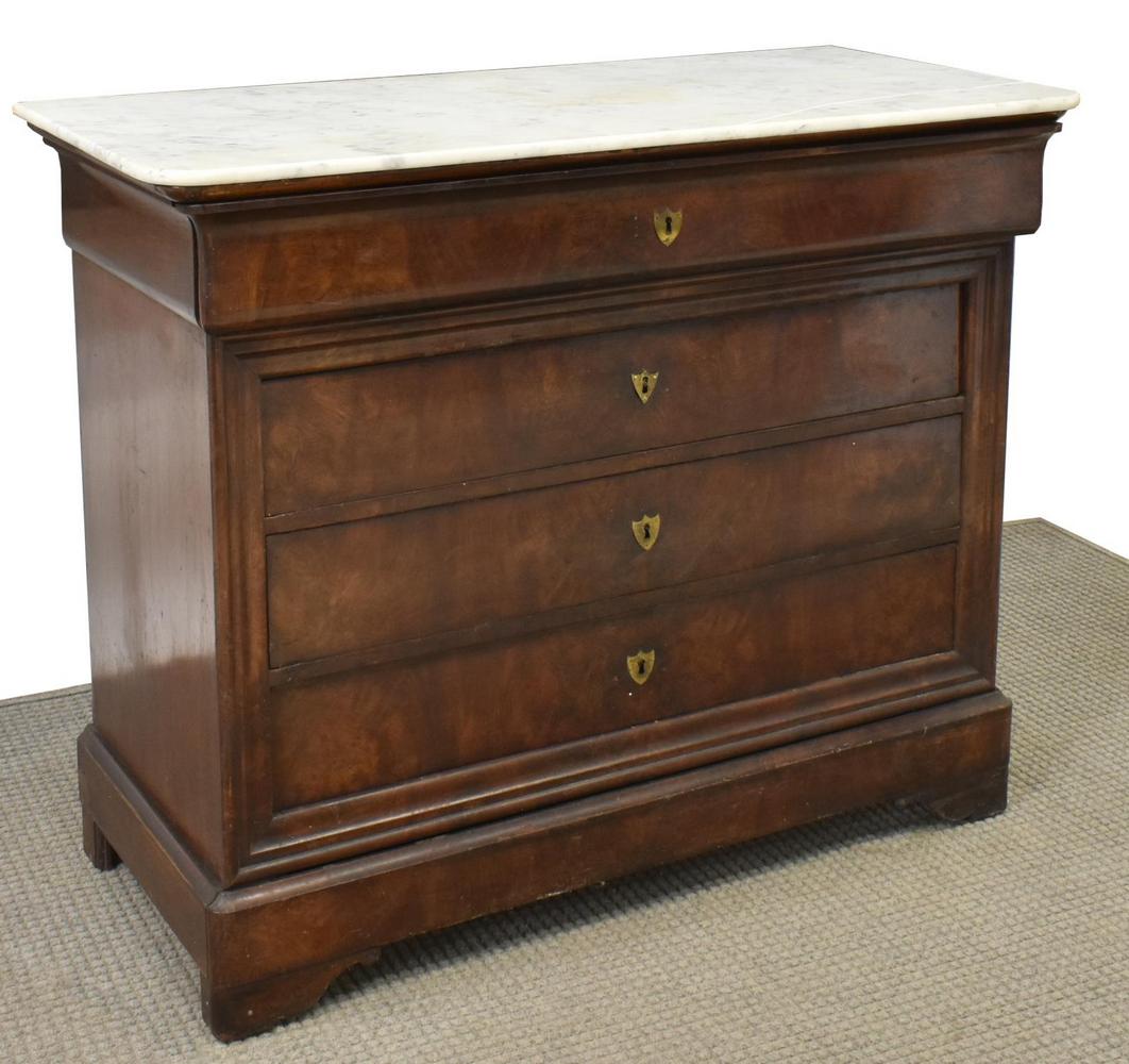 FRENCH MARBLE-TOP MAHOGANY FOUR-DRAWER COMMODE: French Charles X figured mahogany commode, 19th c., marble top with curved front corners, four drawers, matching shield-form escutcheon on each drawer, rising on bracket feet, intact with glue restora