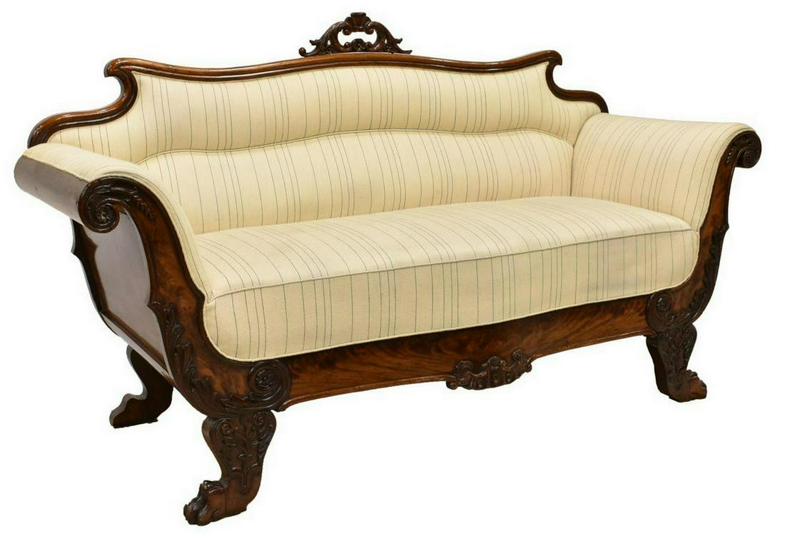 CONTINENTAL BIEDERMEIER STYLE MAHOGANY SOFA: Continental Biedermeier style sofa, late 19th c., the backrest with openwork crown carved with floral and foliate motifs, resting atop a frame accented by elements from crown and scrollwork, encasing 