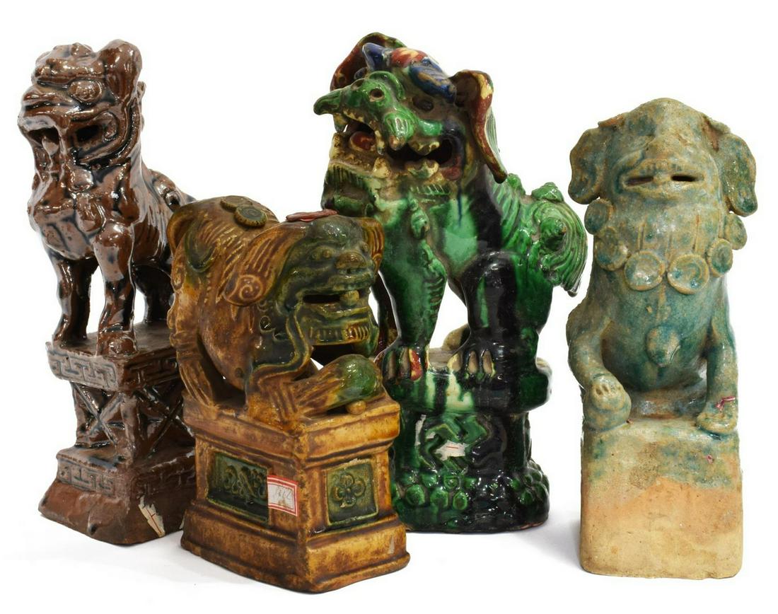 (4) CHINESE GLAZED FOO DOG INCENSE HOLDERS: (lot of 4) Chinese glazed foo dog incense holders, comprising: (1) green glazed with paw atop ball, center hole to top approx 8.25"h, 3"w, 4"d; (1) green, brown and blue glaze with detail to face, dri