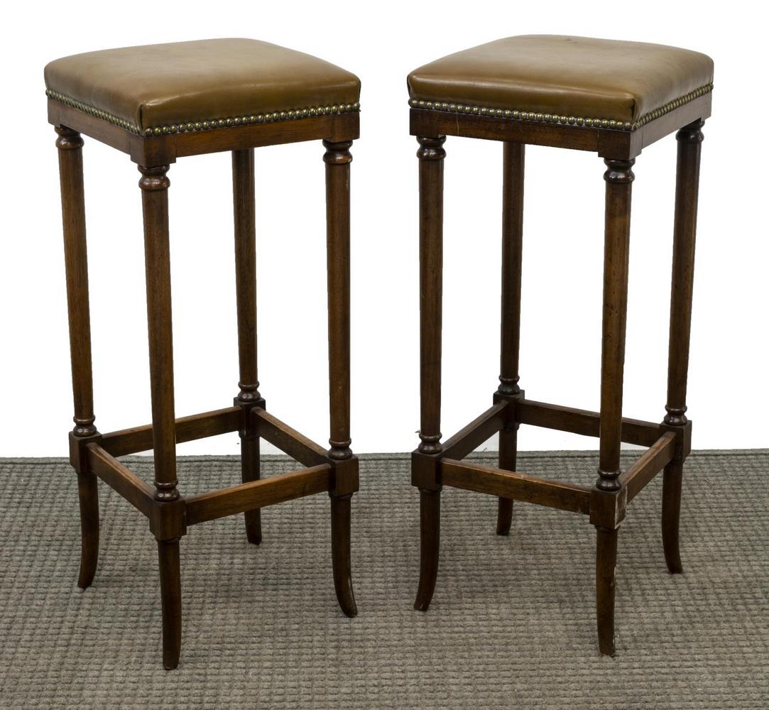 (2) ENGLISH BEVAN-FUNNELL REPRODUX BAR STOOLS: (pair) English bar stools, Bevan-Funnell Reprodux, late 20th c., leather upholstered seat with nail head accents, rising on box stretcher-joined legs, approx 30"h, 12"w, 12"d Start Price: $80.00