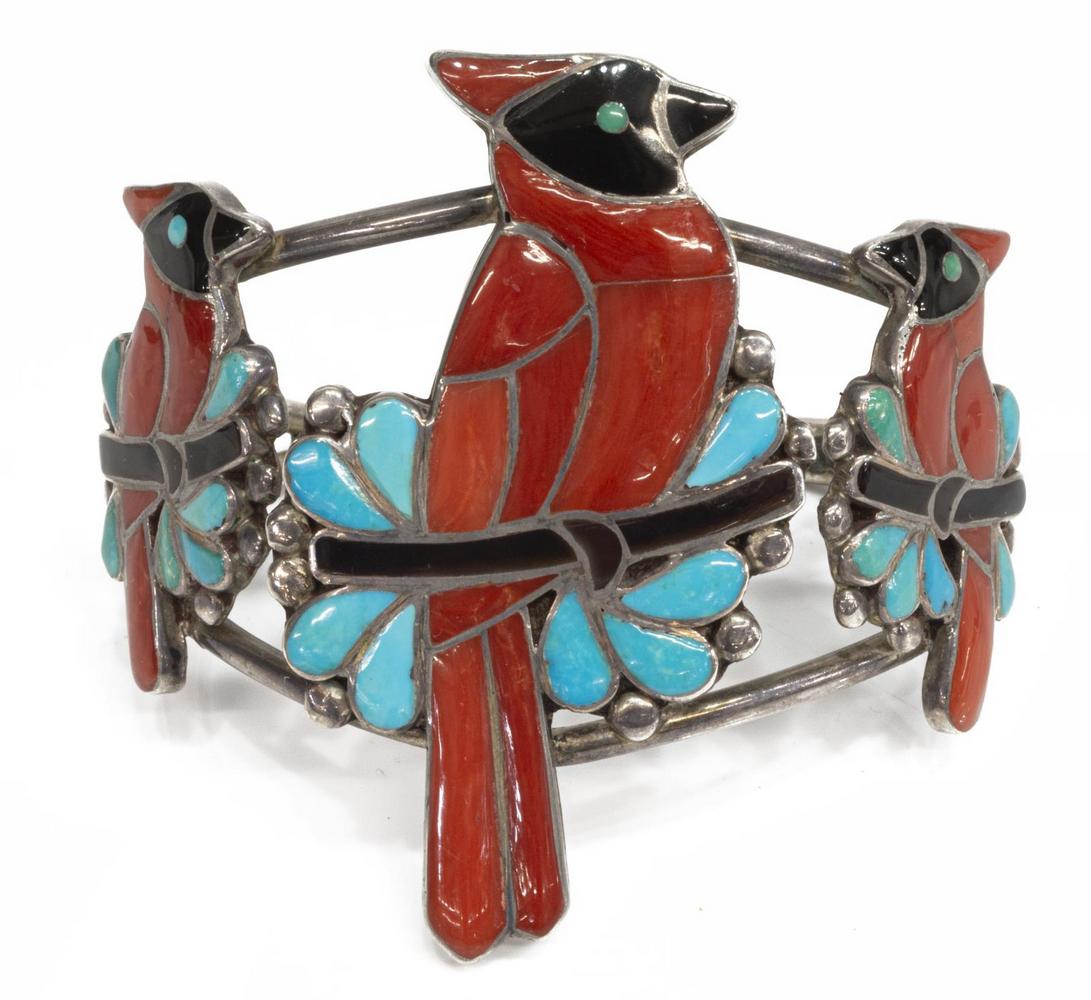 PORFILIO SHEYKA (ZUNI) INLAID CARDINALS CUFF: Native American silver (content unknown) cuff bracelet, Porfilio Sheyka (Zuni, b.1938), set with red coral and turquoise, forming three cardinals, on a split band, approx 2 3/8"w, interior: (end to en