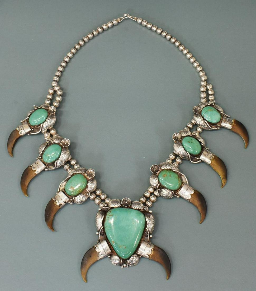 NATIVE AMERICAN TURQUOISE SQUASH BLOSSOM NECKLACE: Large Native American silver (content unknown) and turquoise squash blossom necklace, hallmarked T T(second T is upside down), a single strand bench beads, leading to double strand holding central naj