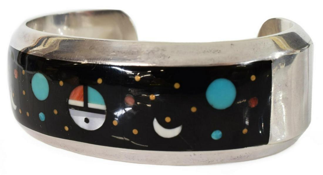 WILLIE SHAW (NAVAJO) MOSAIC INLAID STERLING CUFF: Native American multi-stone mosaic sterling silver inlaid cuff bracelet, signed WS (Willie Shaw, Navajo), sterling, 0.75"w cuff having inlaid celestial design of planets, stars and geometrics, on a bl