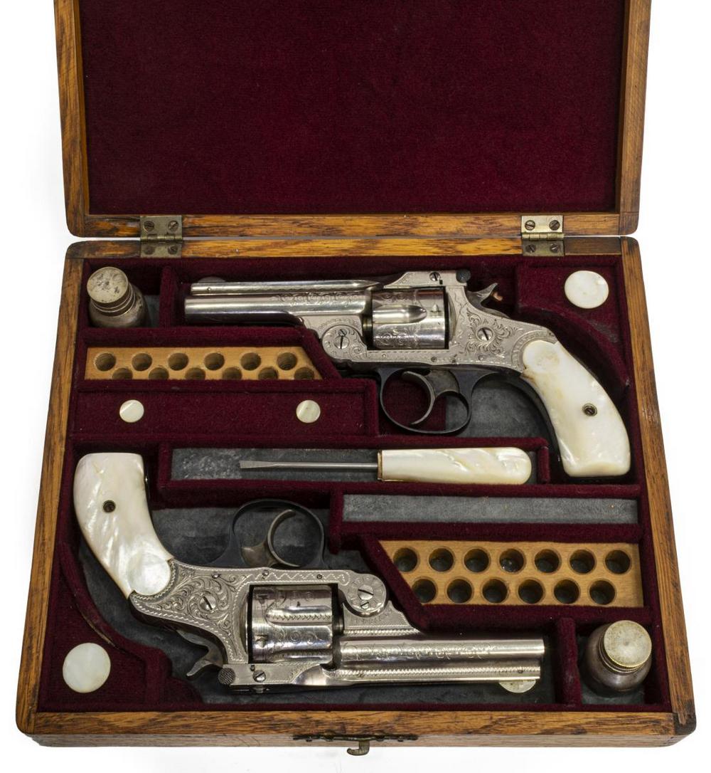 (2) MARLIN 1878 DA.38 FACTORY ENGRAVED REVOLVERS: (pair) Cased Marlin Model 1887 double action revolvers, .38 caliber, five round cylinders, 3.25" top break barrels with two line patent and address, factory engraved nickel finish with mother of pearl