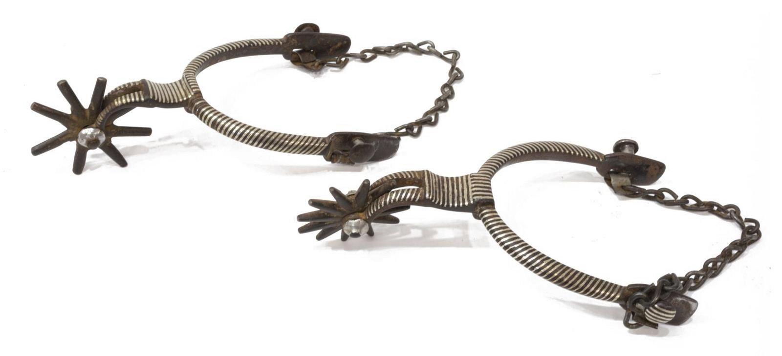 (2) IRON SPURS WITH SILVER INALY, MEXICO: (pair) Mexican iron spurs with silver inlay, 2.25" rowels, inside yoke approx 3.25"w, 1lb total Start Price: $100.00
