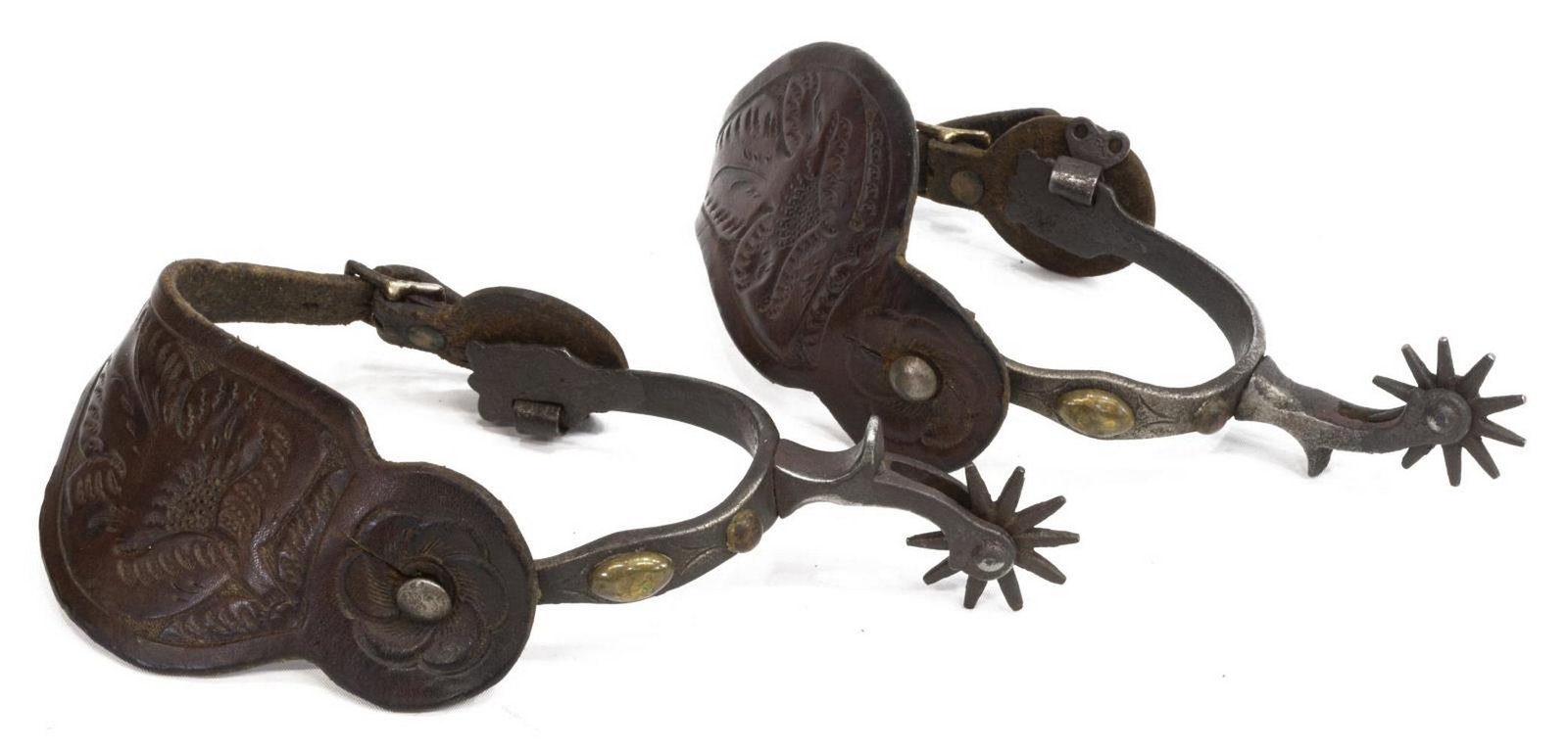 CALIFORNIA STYLE COWBOY SPURS: (pair) California style cowboy spurs, early 20th c., brass accents, 10 point rowels, tooled leather straps, inside yoke approx 3.25"w, 3.5"d Start Price: $80.00