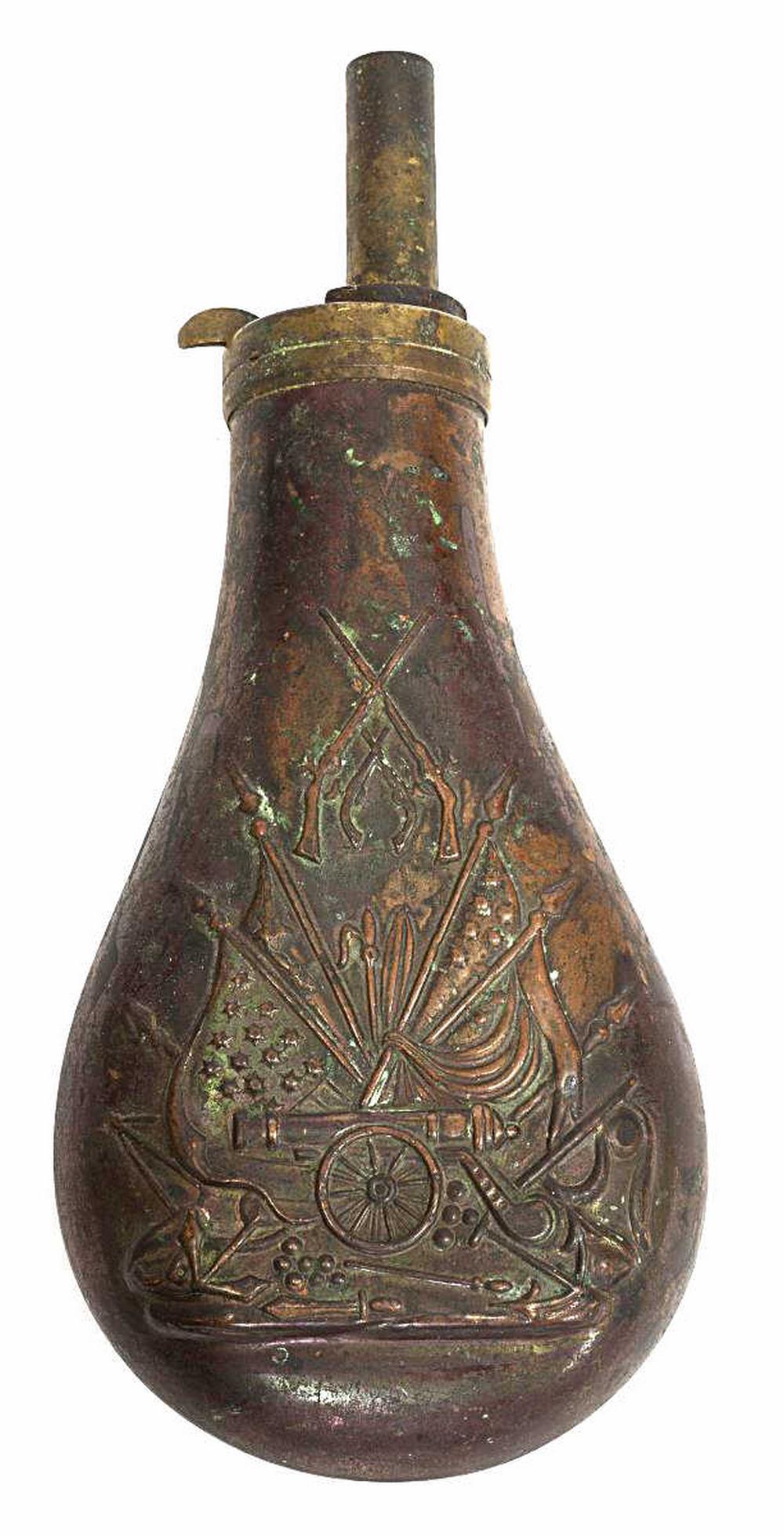 COLT STYLE POWDER FLASK: Colt style powder flask, 19th c., one side with embossed design depicting crossed rifles and revolvers above the stand of flags pattern with cannon, straight spout, 7.75"h, 3.25"w *Note: illustrated a