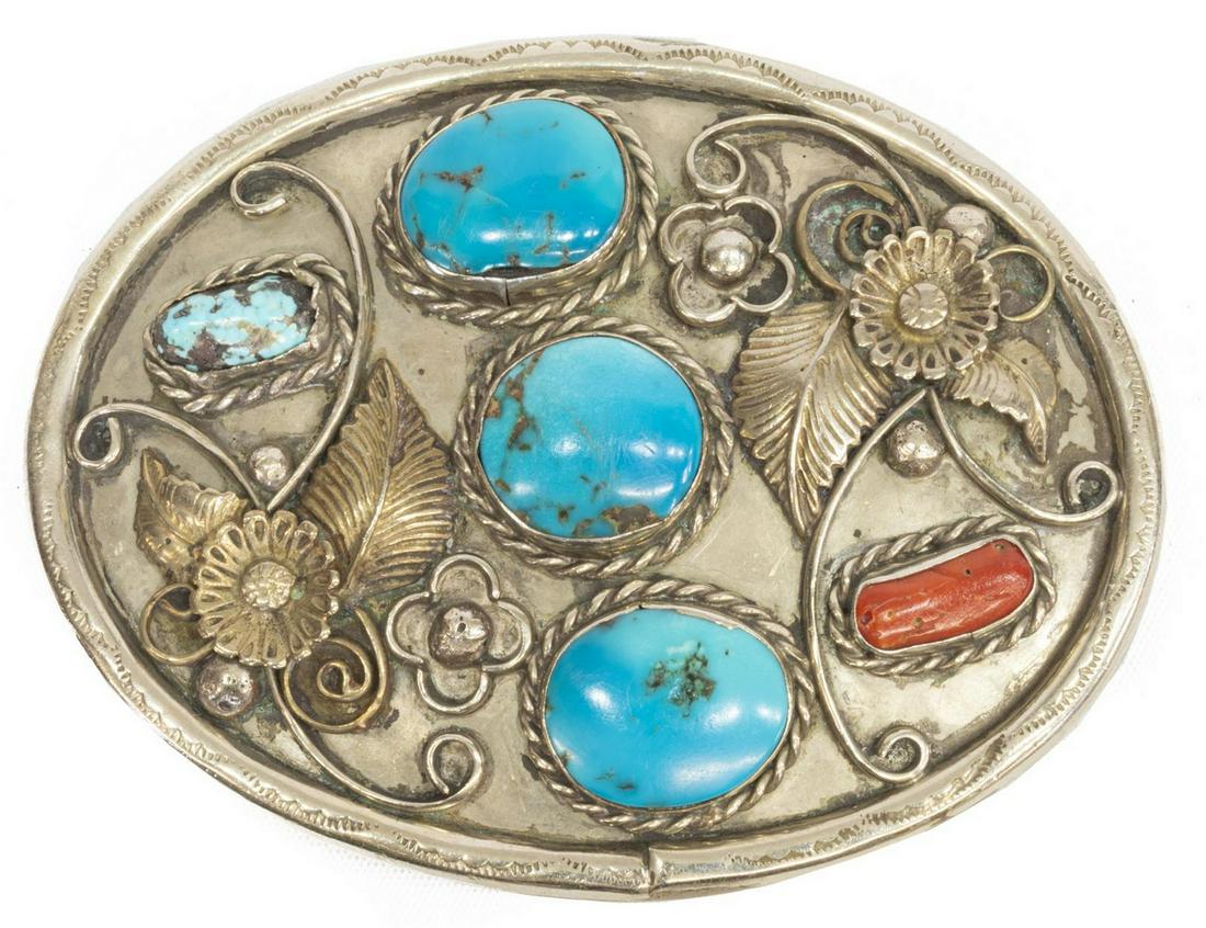 NORMAN LEE (NAVAJO) SILVER TURQUOISE CORAL BUCKLE: Native American silver (content unknown) belt buckle, signed N. Lee (Norman Lee, Navajo), oval form with worked border, applied flowering vines fitted with turquoise and red coral, approx 2.5"h, 3.5"l