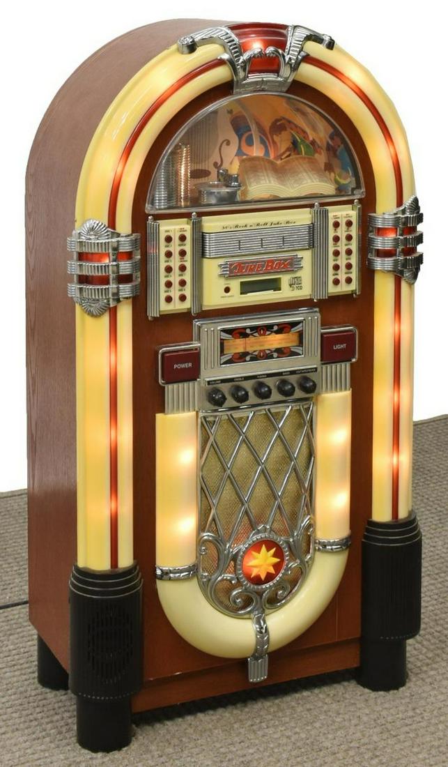 ROCK-N-ROLL COMPACT DISK JUKEBOX & REMOTE: Rock-n-Roll compact disk jukebox and remote, 20thc., in the style of a 1950s jukebox, featuring 7 CD changer, AM/FM radio, and cassette player, having chrome accents, half-circle window reveals faux s