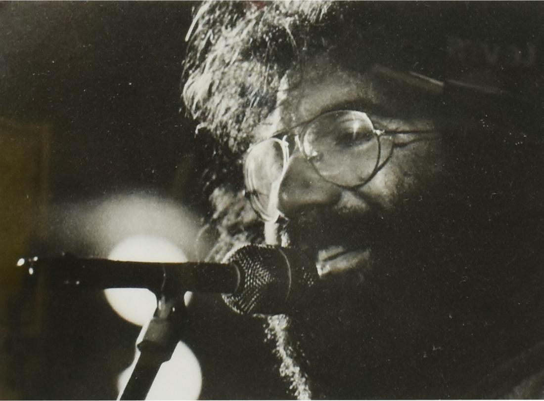 PHOTO JERRY GARCIA, GRATEFUL DEAD BY MICHAEL SMITH: Framed photograph of Jerry Garcia (1942-1995) of The Grateful Dead, titled "Jerry Garcia in New Orleans" signed by photographer Michael P. Smith (New Orleans, 1937-2008), sight: 6.5"h, 8.5"w, overall: