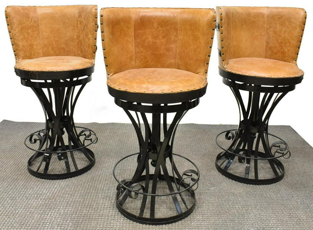 (3) OAK SLATTED BARREL BACK SWIVEL BAR STOOLS: (lot of 3) Bar stools, fashioned from reclaimed oak-slatted tequila barrels, leather upholstered back and seat, with decorative hammered finish nail head trim, on scrolled iron pedestal base with foot