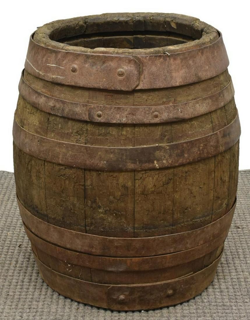 OAK STAVE WINE BARREL WITH IRON STRAPPING: Oak stave wine barrel with iron strapping, approx 28"h, 19"diam Start Price: $50.00