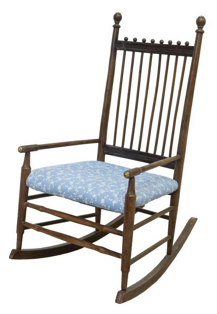 AMERICAN VICTORIAN STICK & BALL ROCKING CHAIR: American Victorian stick and ball rocking chair, late 19th c., having spindle back, padded seat, rising on stretcher-joined legs, on rocker rails, repair to top rail, approx 38.25"h, 21"w, 29"d Start 