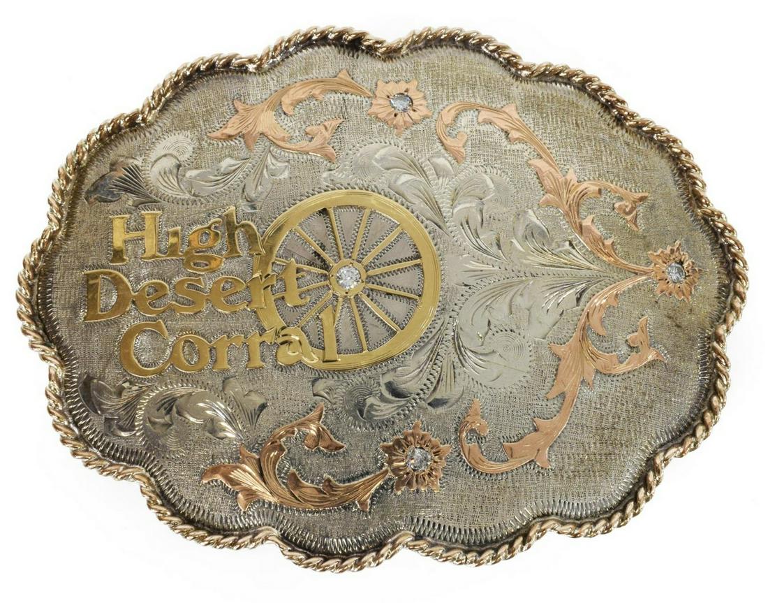 VOGT SILVERSMITHS WESTERN GOLD& SILVER BELT BUCKLE: Vogt Silversmiths hand engraved sterling silver, 10kt and 14kt gold overlay belt buckle, undulating rope edge, enclosing "High Desert Coral" highlighted in gold engraved and rose gold accented foliate