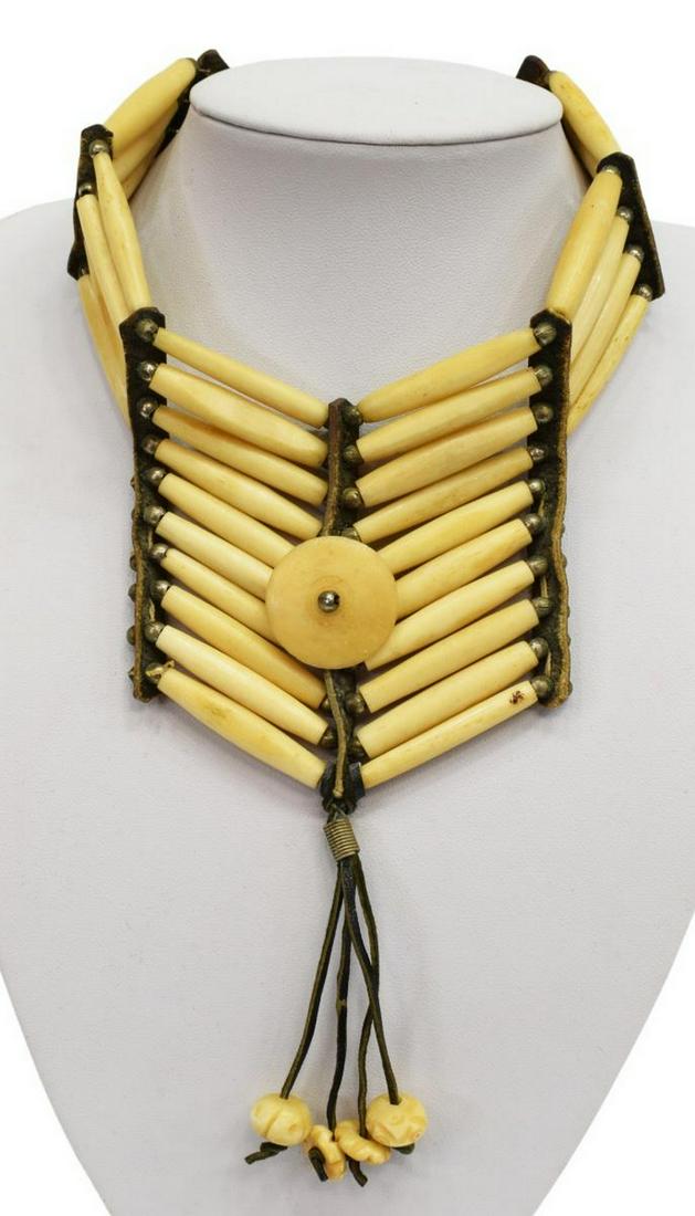 NATIVE AMERICAN BONE & LEATHER CHOKER NECKLACE: Native American choker necklace fashioned with pipe bone, silver beads, joined to leather end pieces (ties), approx 27"l (end to end), 025lb Start Price: $50.00