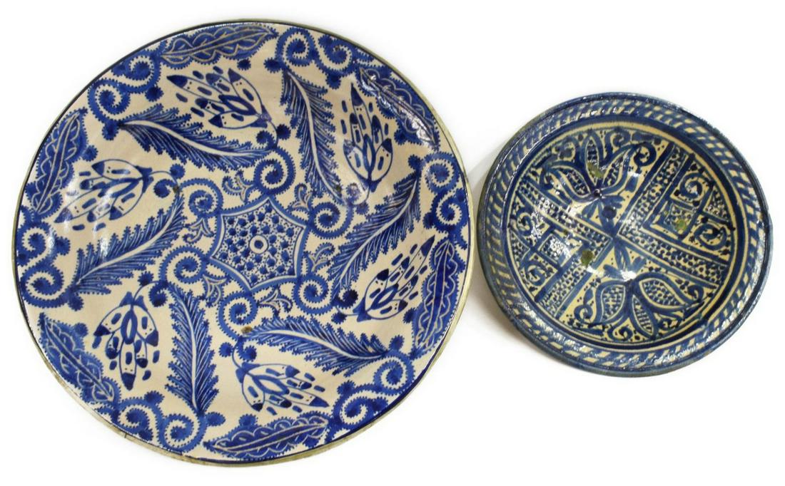 (2) SPANISH MAJOLICA TIN-GLAZED EARTHENWARE BOWLS: (lot of 2) Spanish tin-glazed earthenware bowls, with blue stylized foliate motifs, including: (1) large bowl, with metal-bound foot, approx 4 1/8"h, 15.5"diam, (1) small bowl, chips, hairline at rim,