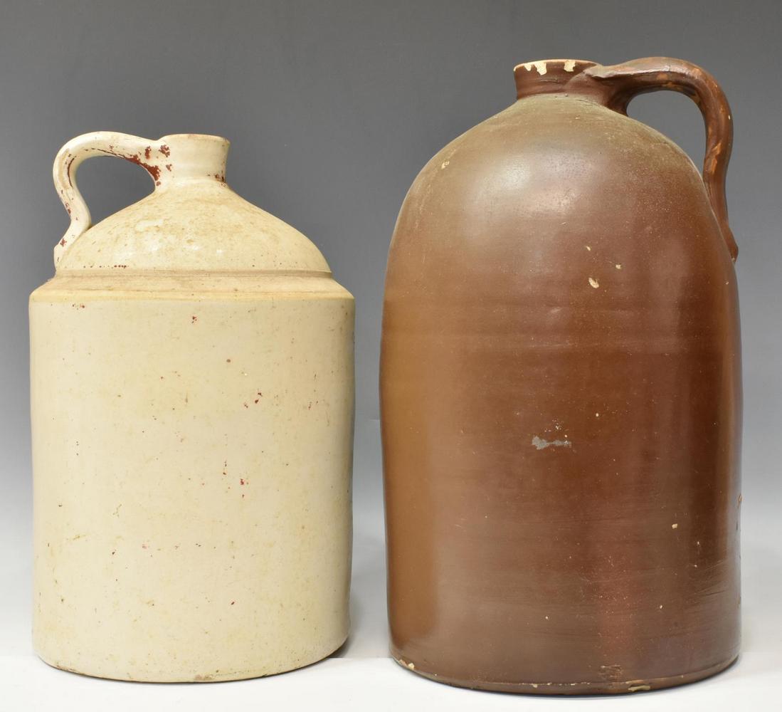 (2) AMERICAN STONEWARE & REDWARE JUGS: (lot of 2) American stoneware and redware jugs, late 19th c., cylindrical form, with one loop handle, including: (1) with white glazing, approx 13.75"h, 9.5"diam, (1) with red-brown glazing, chipping