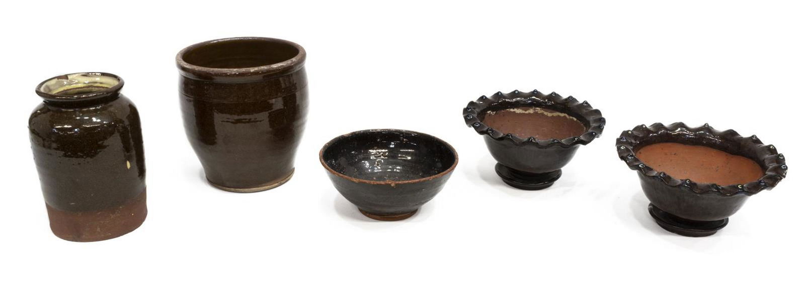 (5) AMERICAN REDWARE JUGS, BOWL & PLANTERS: (lot of 5) American redware pottery, late 19th/ early 20th c., including: (2) planters, with attached saucer, in Albany slip, with ruffled rim, both with molded star pattern underfoot, both with chipp