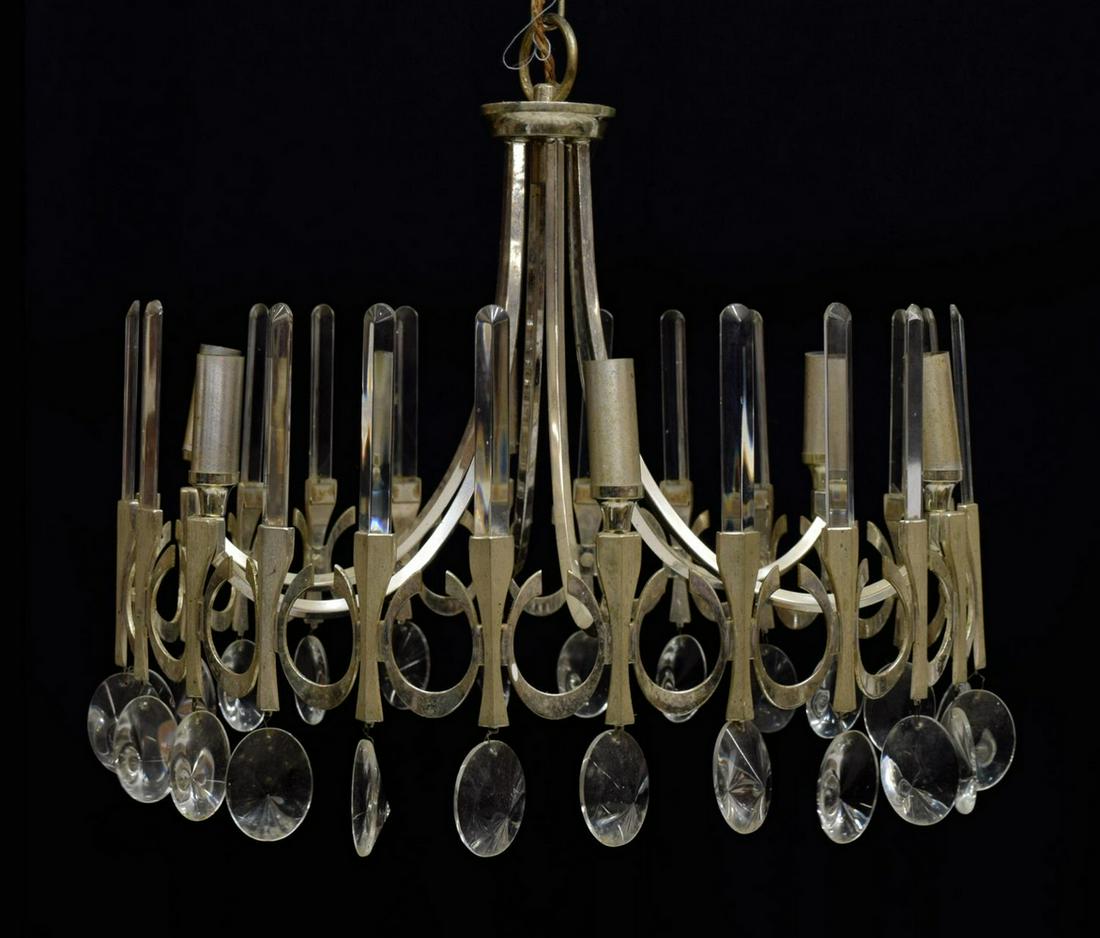 ITALIAN MID-CENTURY MODERN CHANDELIER, SCIOLARI: Italian mid-century modern six- light chandelier, c. 1970, design by Gaetano Sciolari, silver tone metal scrolling arms with a pierced band of vertical "C" design, accented by oval and column prisms,