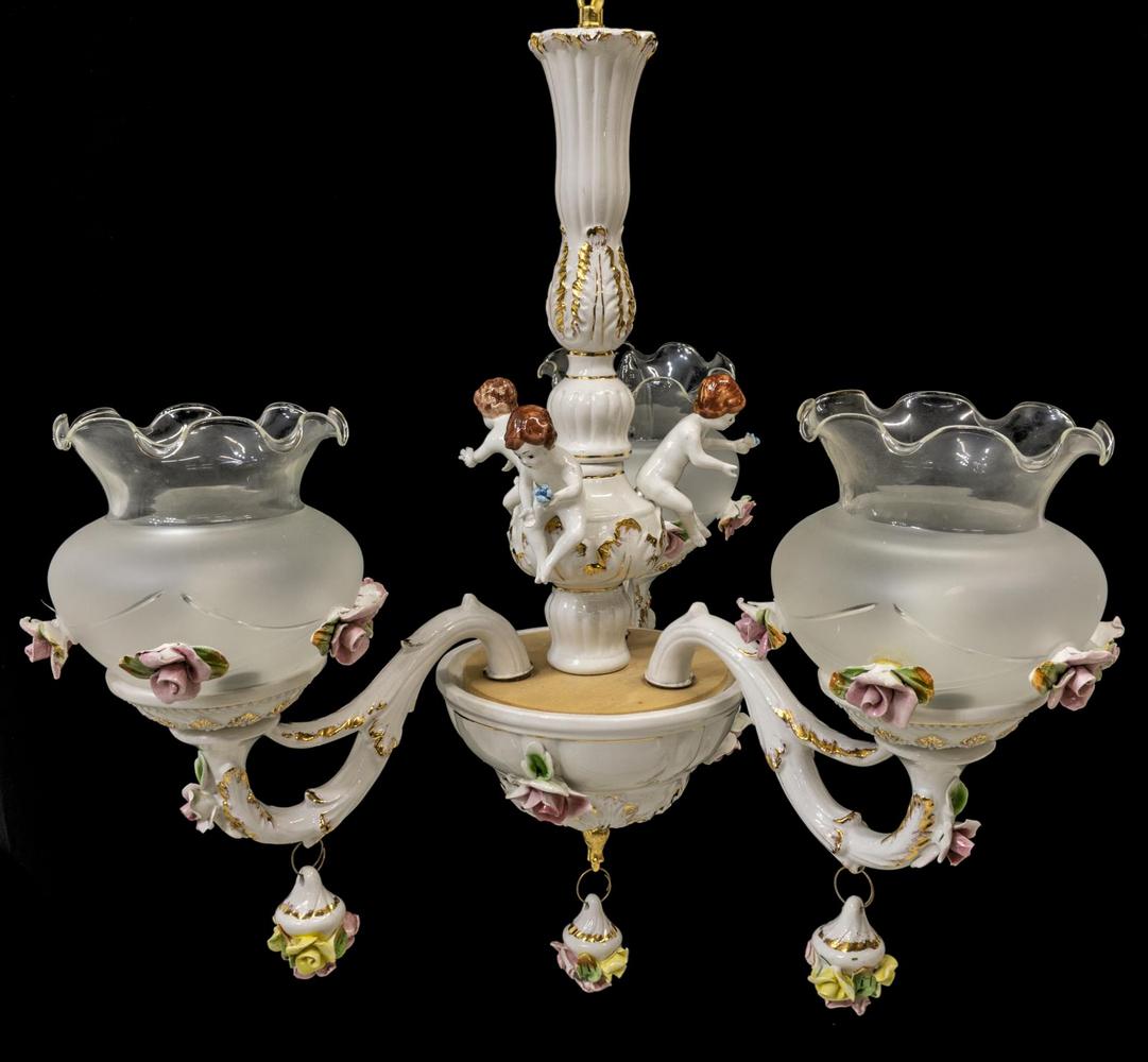 CAPODIMONTE STYLE THREE-LIGHT CHANDELIER: Capodimonte style three-light chandelier, 20th c., having applied polychrome flowers throughout, with three lights on three arms, each encased in frosted glass shade, branching from standard accented 