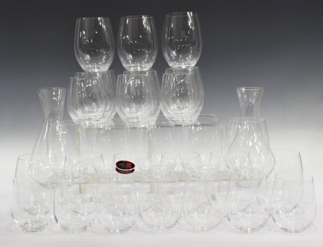 (32) RIEDEL STEMLESS WINE GLASSES & DECANTERS: (lot of 32) Riedel colorless stemless wine glasses and decanters, each marked Riedel underfoot, including: (20) Cabernet / Merlot glasses, "O" pattern, approx 5"h, 3.75"diam, (10) Viognier / Chardonna