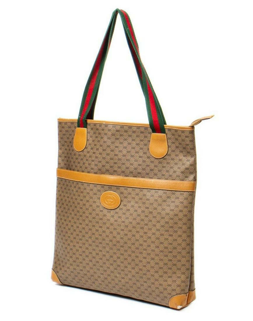 GUCCI BEIGE SUPREME MONOGRAM CANVAS TOTE BAG: Vintage Gucci tote bag, in beige supreme monogram coated canvas, with tan leather lining, slip pocket to front face, red and green web flat handles, zip closure at top, opening to beige woven interior