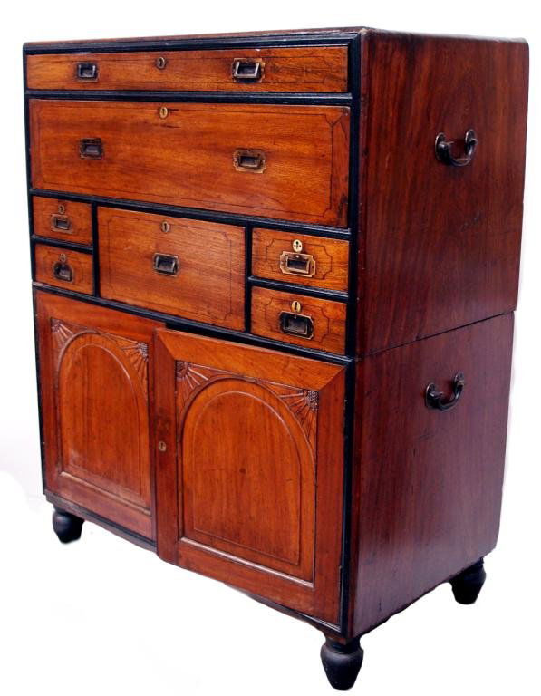 BRITISH ANTIQUE CAMPHORWOOD CAMPAIGN CHEST: Scarce and magnificent British Colonial, China trade camphor wood campaign chest, early 19th century, in two sections with ebony trim; the upper chest having a long document drawer over a well fitted