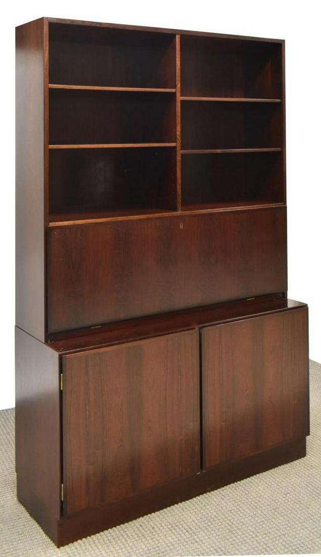 DANISH MID-CENTURY MODERN ROSEWOOD BOOKCASE DESK: Danish mid-century modern rosewood bookcase, Omann Jun, c.1960s, upper section with adjustable shelves, fall-front desk, lower case with double-door cabinet, rising on a plinth base, approx 74"h, 47.2