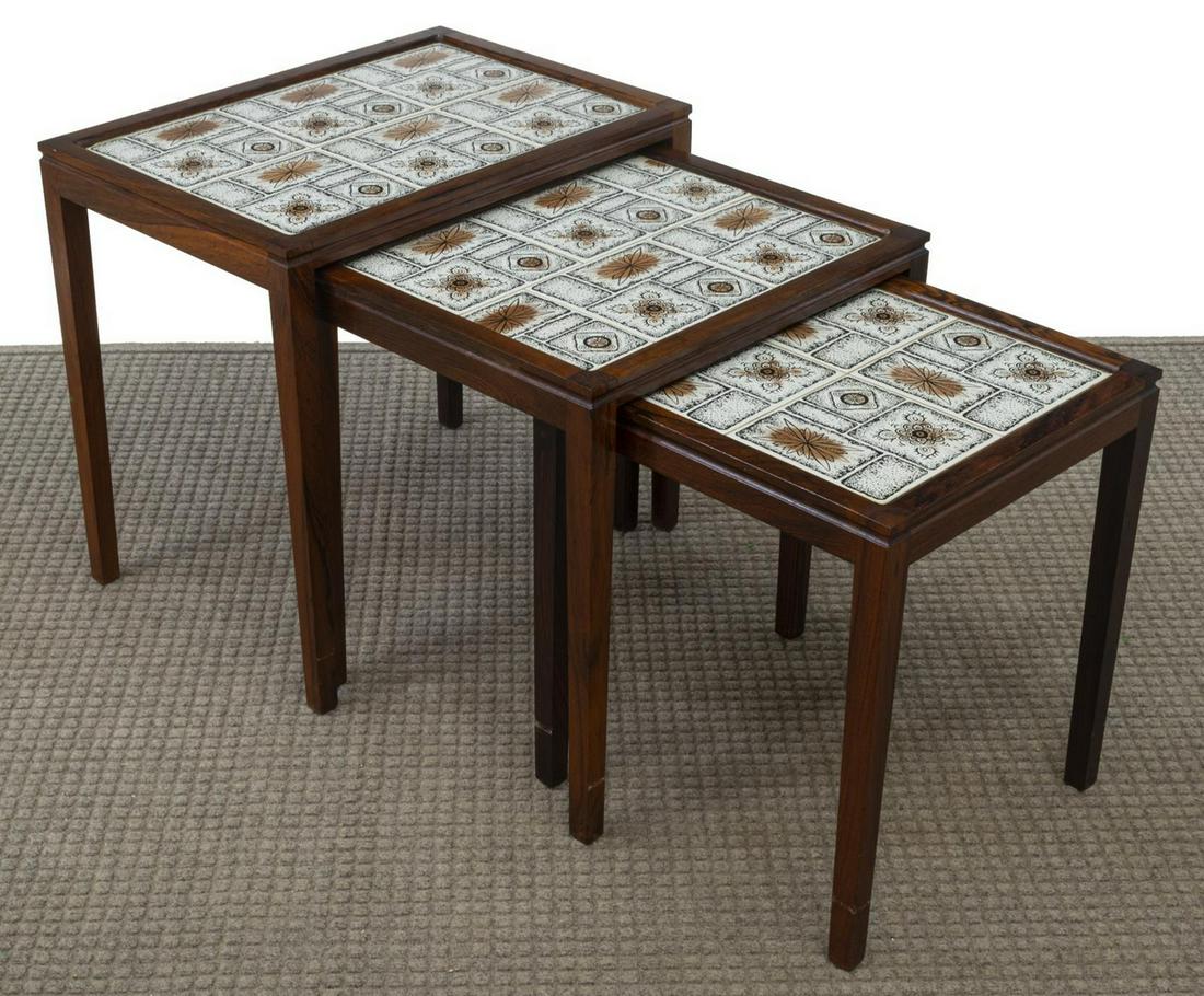 DANISH MID-CENTURY MODERN ROSEWOOD NESTING TABLES: Danish mid-century modern rosewood nesting tables, c.1960s, having tile top design, rising on tapered legs, largest: approx 19"h, 20.5"w, 14.5"d, smallest: approx 16.75"h, 14.5"w, 14.5"d Start Price: 