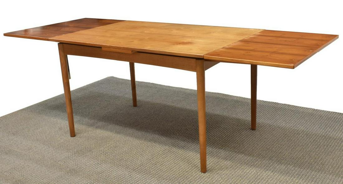 DANISH MID-CENTURY TEAK DRAW-LEAF DINING TABLE: Danish mid-century modern teak dining table, c.1950s, rectangular top with draw leaves, rising on tapered legs, tonal variation between tabletop and leaves, approx 29.25"h, 49"w, 33.5"d, extended: app