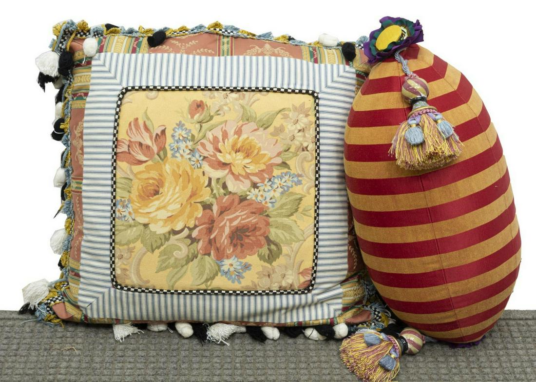 (2) MACKENZIE-CHILDS ECLECTIC ACCENT PILLOWS: (lot of 2) Mackenzie-Childs eclectic accent pillows, including: (1) floral tassel throw pillow, having striped border, black and white tassel fringe, and button back, missing some tassels, approx 22"w