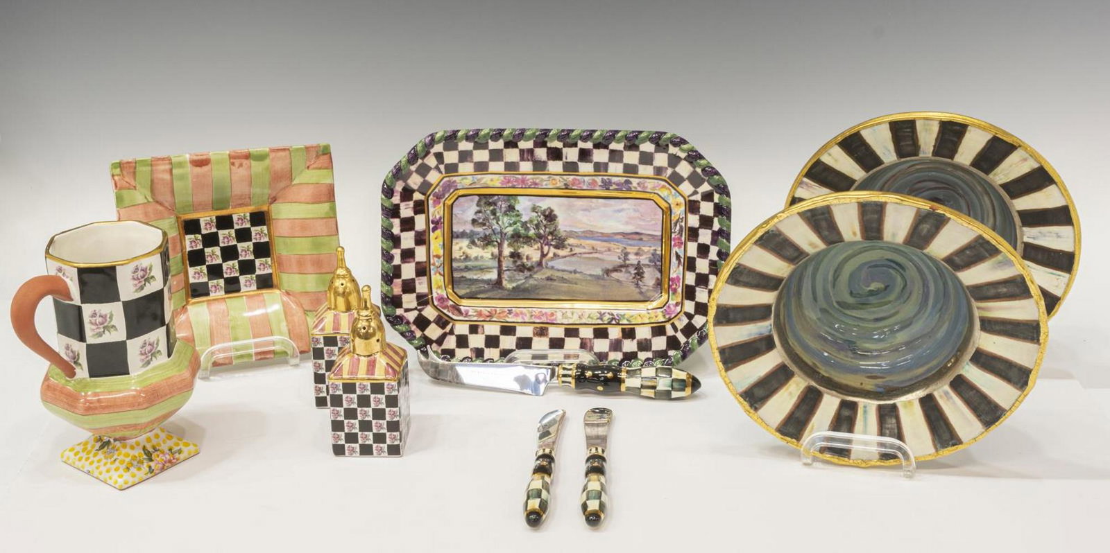 (10) MACKENZIE-CHILDS TABLEWARE, BOWLS, TRAY, CUP: (lot of 10) Mackenzie-Childs tableware, including: (2) hand-painted ceramic bowls, approx 2.75"h, 8.5"diam; (2) salt and pepper shakers, checkered pattern with rose, approx 5"h, 2"w, 2"d; (1) tray wit