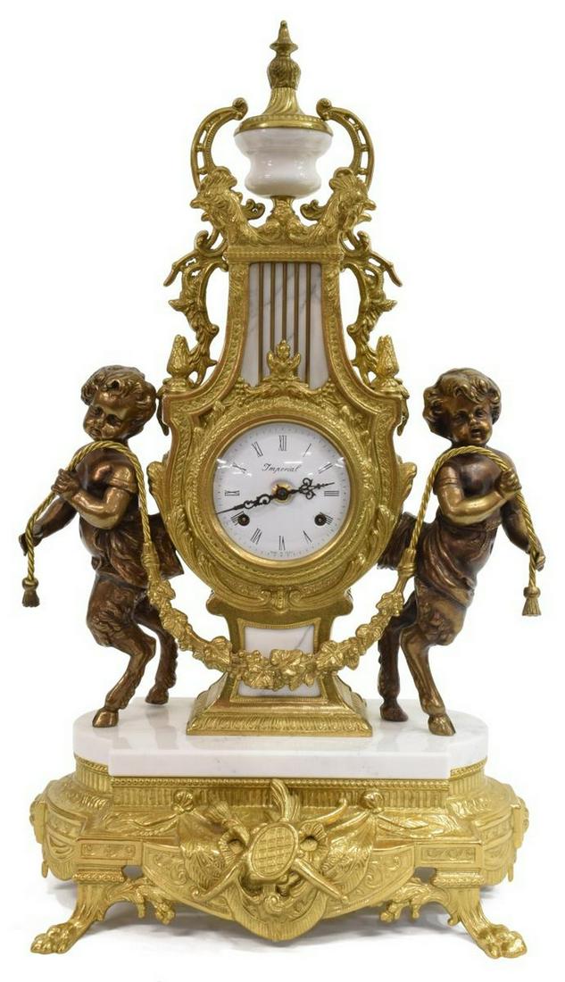 ITALIAN IMPERIAL GILT METAL SATYR MANTEL CLOCK: Italian gilt metal mantel clock, 20th c., urn-form finial over lyre harp case, cockerel masks, full-body satyr figures flanking white enamel dial with black roman numerals, marked Imperial, made in It