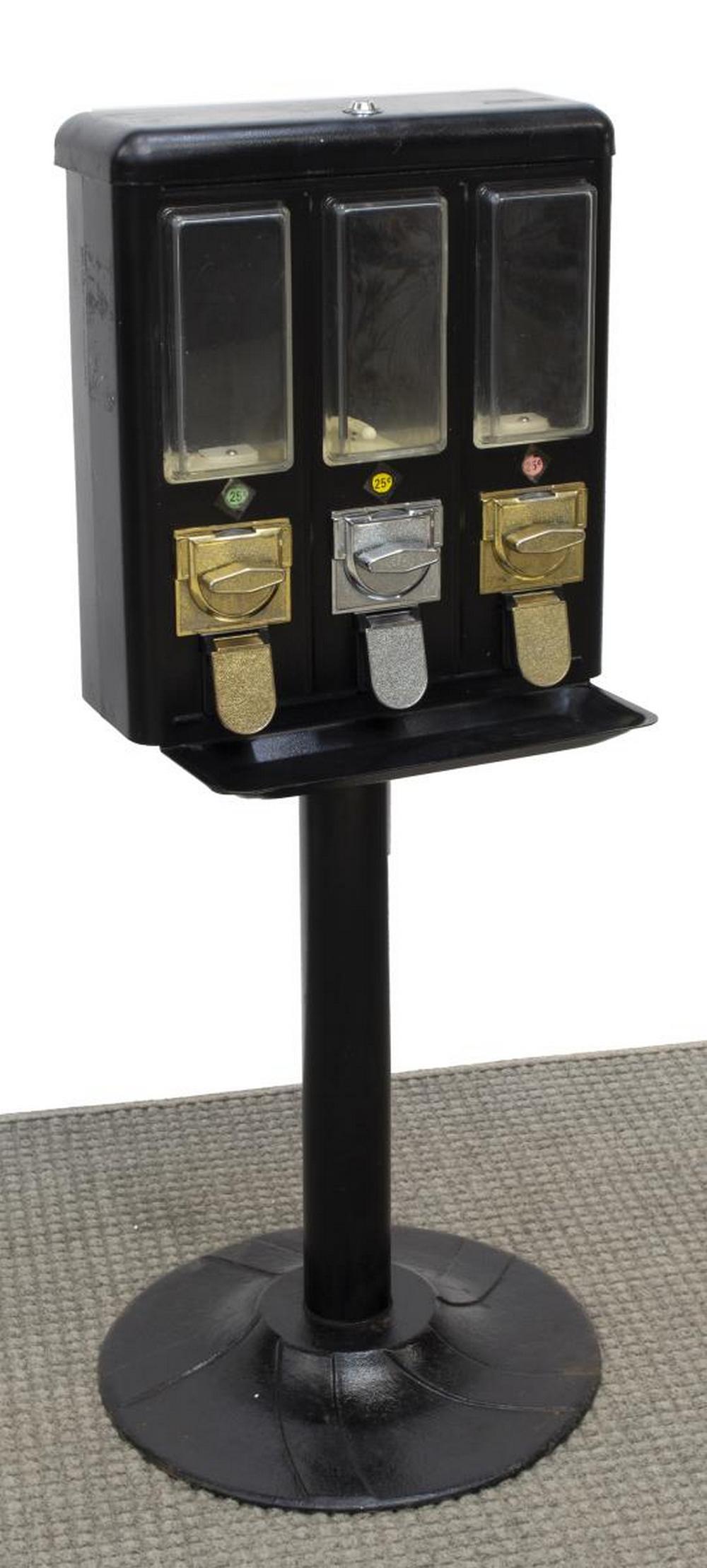 THREE SECTION 25 CENT VENDING MACHINE: Three section 25 cent vending machine, within a cast iron frame, includes key for top fill section and key for lower back door coin collection, no visible maker's name, approx 42.5"h, 16.25"w, 6.25"d,