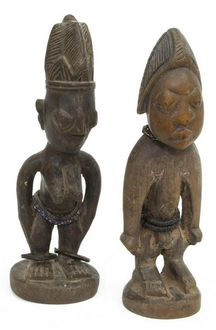 (2) CARVED AFRICAN YORUBA ERE IBEJI TWIN FIGURES: (lot of 2) African carved wood Ere Ibeji figures, Yoruba peoples, Nigeria, each male and female figure crowned with an elaborate hairdo, heshi bead waist accents, one with metal ankle bracelet, natura
