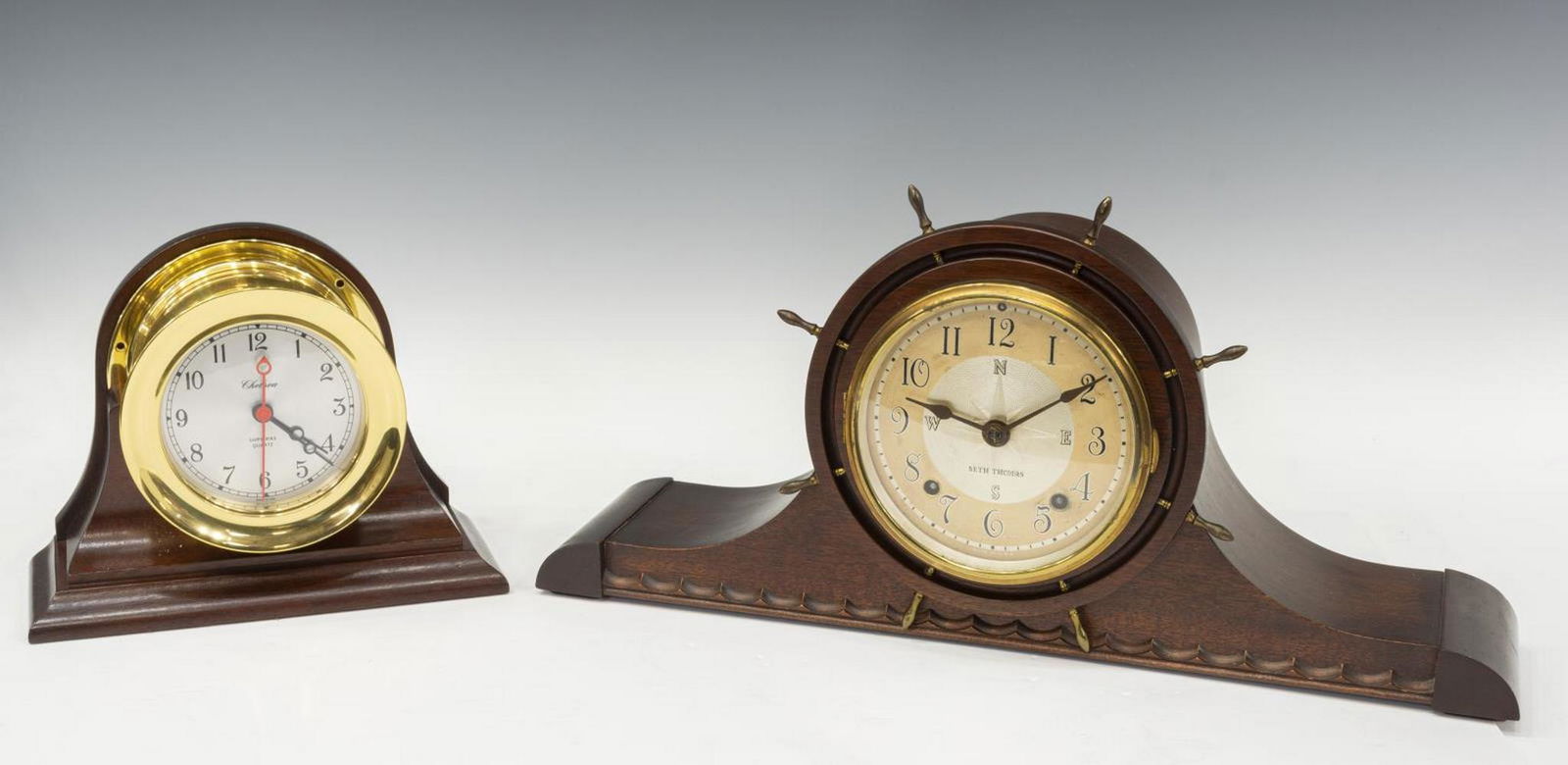 (2) AMERICAN CHELSEA & SETH THOMAS SHIP CLOCKS: (lot of 2) American ship mantel clocks, comprising: (1) Chelsea Shipstrike clock, having quartz movement, black Arabic numerals, in round chrome case, with wood frame, on stepped base, approx 7.25"h,
