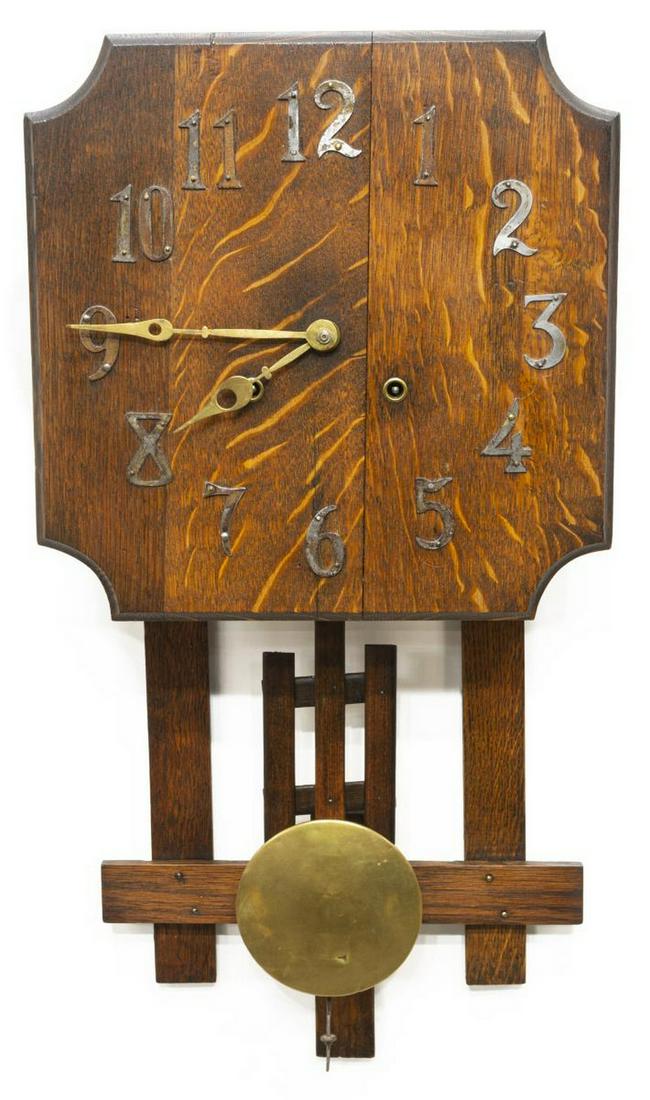 AMERICAN ARTS & CRAFTS MISSION OAK WALL CLOCK: American Arts and Crafts wall clock, early 20th c., oak case, dial with metal Arabic numerals, time and strike movement, approx 25.75"h, 13"w, 4.5"d Start Price: $50.00
