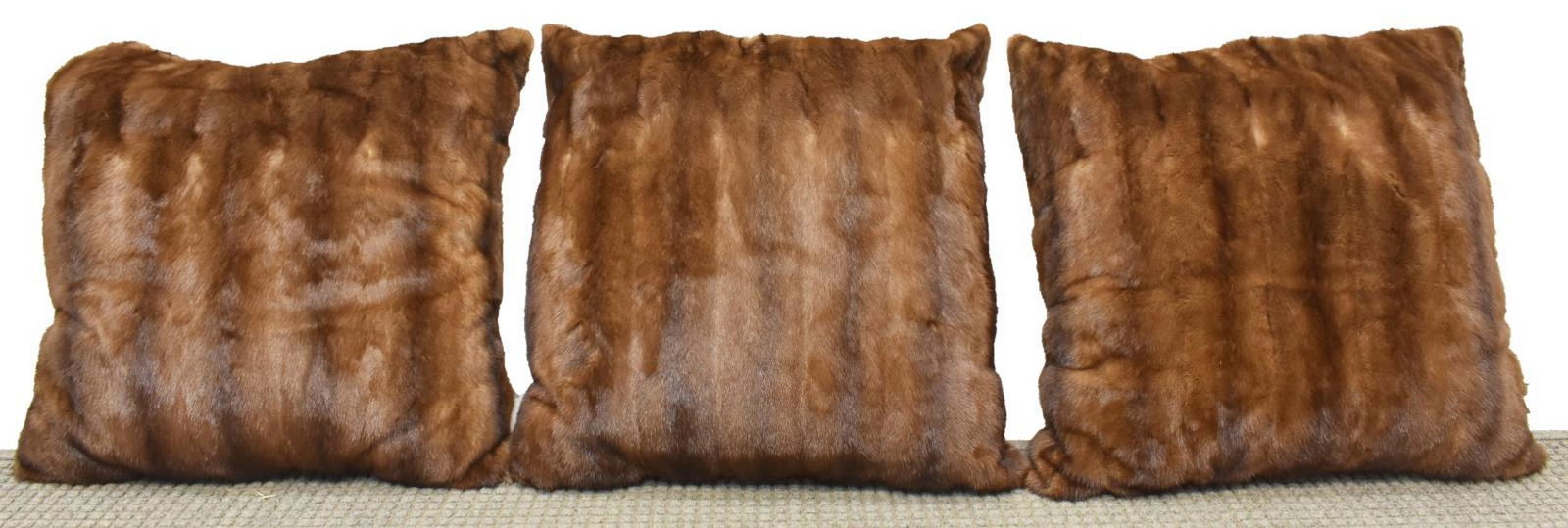 (3) LARGE BROWN MINK FUR MONOGRAMED PILLOWS: (lot of 3) Large brown mink fur pillows, each having S.K. monogramed to front, mink fur to reverse side, each approx 23"l, 23"w, 17.8lbs total Start Price: $80.00