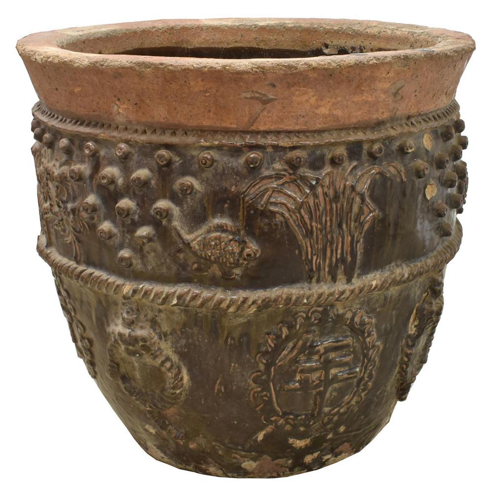 CHINESE CULTURAL REVOLUTION EARTHENWARE PLANTER: Chinese glazed earthenware planter, Cultural Revolution period, having brown and green glaze, adorned with foliate and scrolled accents, approx 26"h, 18"diam Start Price: $60.00