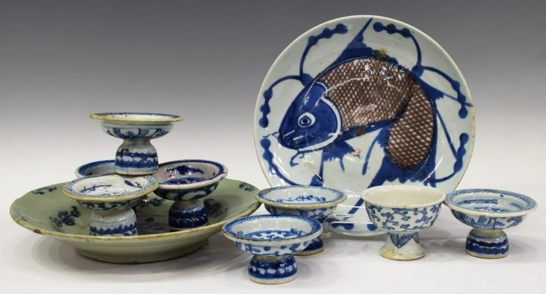 (10) CHINESE BLUE & WHITE PORCELAIN TABLEWARE: (lot of 10) Chinese blue and white porcelain plates, comprising: (8) pedestal dishes, of similar form, having varied lotus and scrolling vine motifs, with cross-hatch borders, largest: approx 2.25"h, 