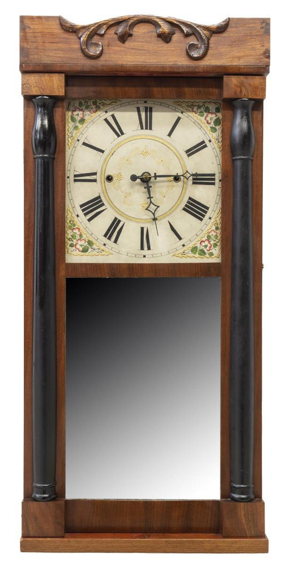 BURR & CHITTENDEN WOOD MOVEMENT CLOCK, C.1830s: American pillar and scroll wall clock, Burr & Chittenden, Lexington, Massachusetts, c.1830s, mahogany case having raised crown with foliate detail, ebonized pilasters framing hazy mirrored door, decor