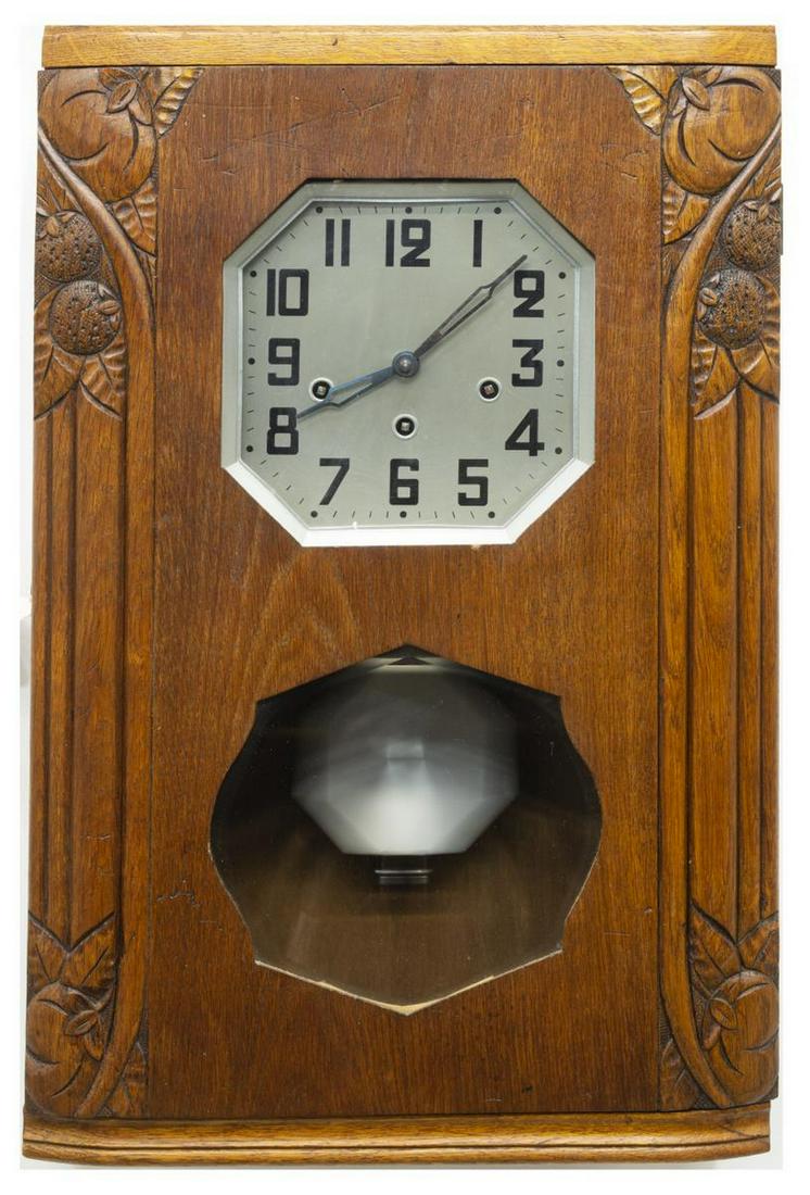FRENCH ART DECO ROMANET MORBIER CHIMING WALL CLOCK: French Art Deco wall clock, Romanet Morbier, c.1930s-1940s, oak case carved with fruit, housing silver-tone metal dial with Arabic numerals, time, strike and chime movement, pendulum window with bevel