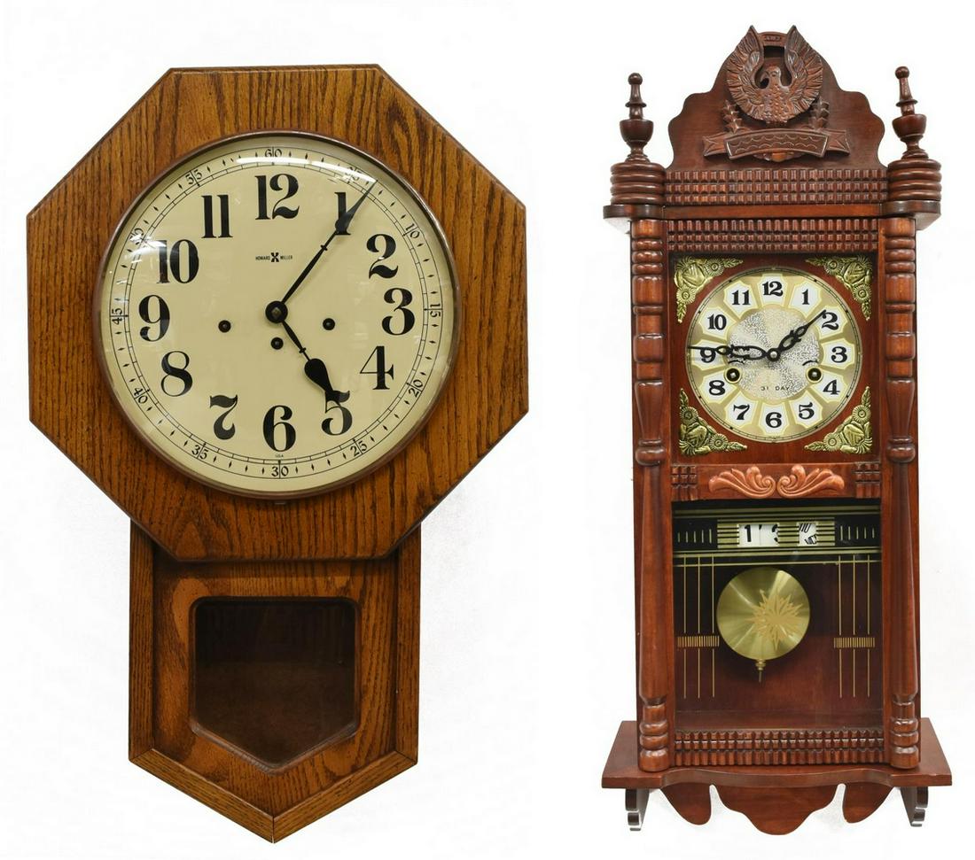 (2) HOWARD MILLER OAK REGULATOR & OTHER WALL CLOCK: (lot of 2) Wall clocks, late 20th c., including: (1) in a mahogany finish, pediment with eagle flanked by turned finials, glazed door, dial with Arabic numerals over calendar function, approx 28"h, 11