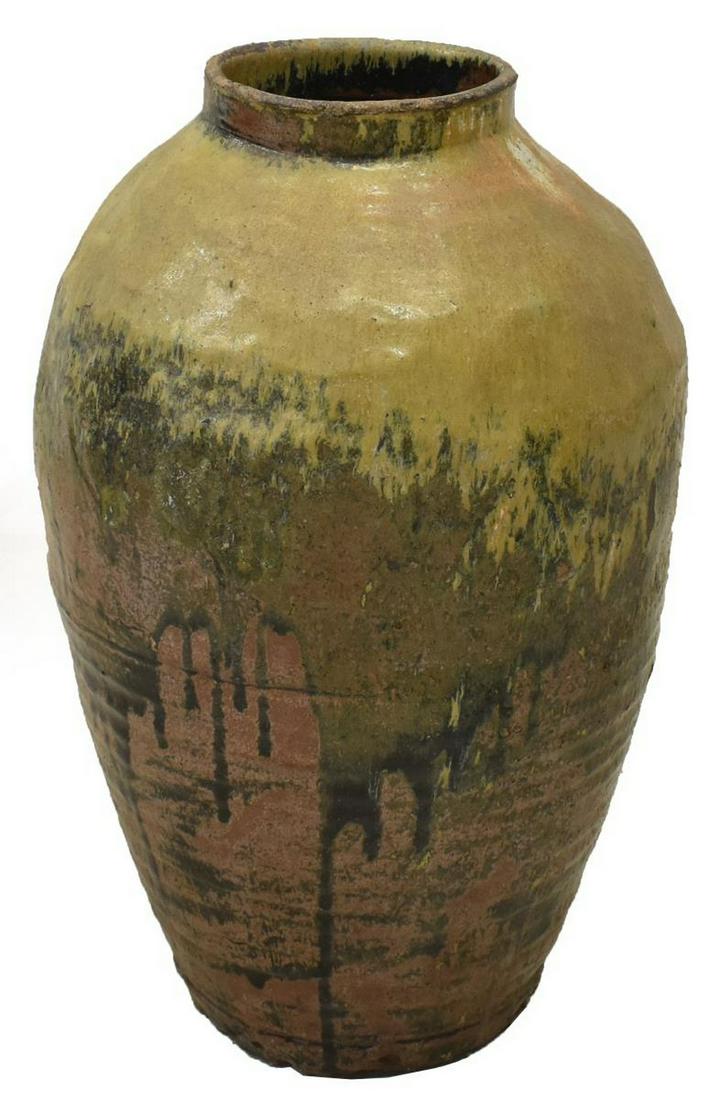 LARGE CHINESE GLAZED EARTHENWARE WINE JAR: Large Chinese earthenware wine jar, in partial green glaze, narrowing toward round base, approx 30"h, 19"diam Start Price: $40.00