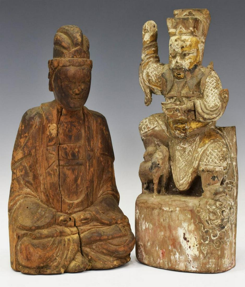 (2) CHINESE CARVED SEATED TEMPLE BUDDHA FIGURES: (lot of 2) Chinese carved wood temple figures: (1) Buddha figure with hand raised and foot resting on animal, having remnants of gold gilt, approx 11"h, 4.5"w, 2"d, (1) seated Buddha, crossed leg in m
