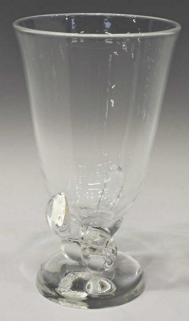 STEUBEN GEORGE THOMPSON ART GLASS FLOWER VASE: Steuben art glass flower vase, designed by George Thompson, model no. 7913, tapered bowl over knot-shaped stem, engraved signature underfoot, approx 8.5"h, 4.75"diam, 2.5lbs Start Price: $50.00