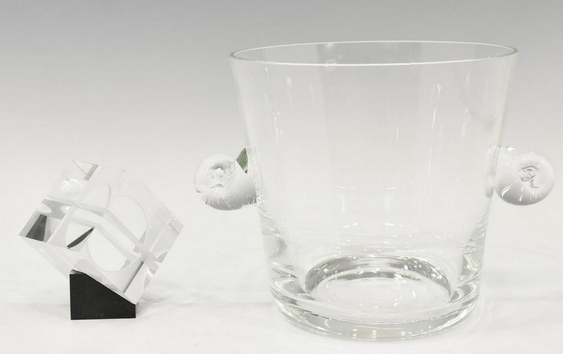 (2) TIFFANY & CO. ICE BUCKET & STEUBEN PAPERWEIGHT: (lot of 2) Cut crystal ice bucket and paperweight, each having acid etched maker's mark, comprising: (1) Tiffany & Co. champagne/ ice bucket, having dual scrolled handles, narrowing toward round base,