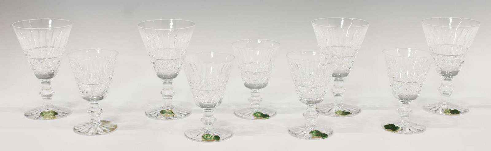 (9) WATERFORD 'TRAMORE' CUT CRYSTAL STEMWARE: (lot of 9) Waterford "Tramore" cut crystal stemware, with vertical and crossed cuts, on a shaped stem, including: (4) white wine stems, approx 5"h, 3 1/8"diam, (5) port wine stems, approx 4"h, 2 5/8"d