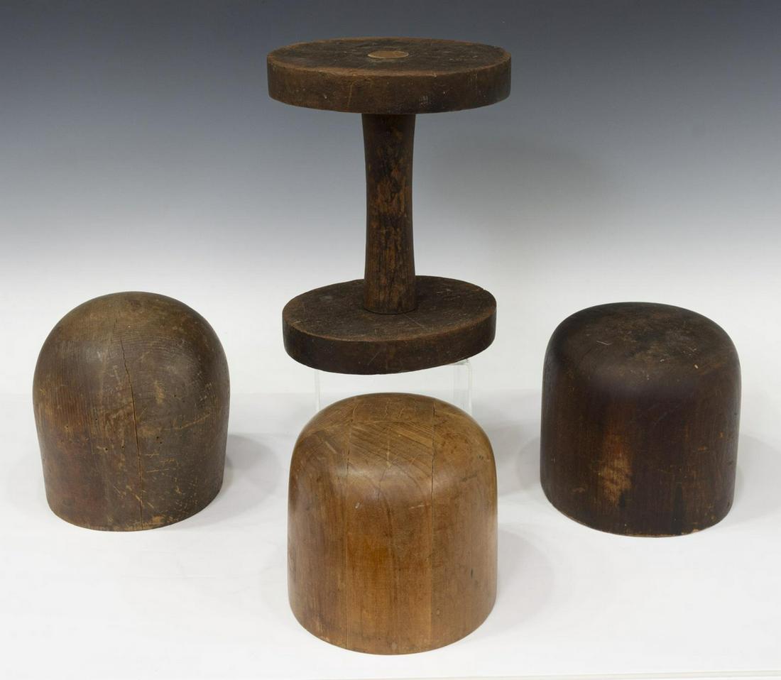 (4) MILLINERY WOOD HAT MOLDS & STAND: (lot of 4) Wood hat molds and stand, various sizes, one stamped A-1 Woodworking Co. Los Angeles; splits and wear from use, stand: approx 9.5"h, 7.5"w, 6.25"d; largest hat mold: approx 7"h, 6.75"w, 6"d